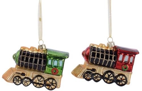 Two glass train ornaments, one green and one red, on a white background.
