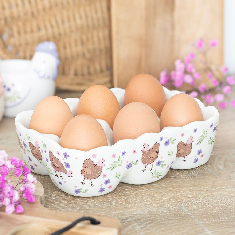 Decorative ceramic egg tray that has a floral design with cute chickens.