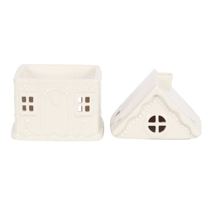 White ceramic house-shaped decor on a white background