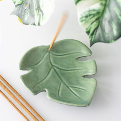 Green ceramic cute leaf-shaped incense stick holder. Can be used as a trinket dish or candle holder as well.