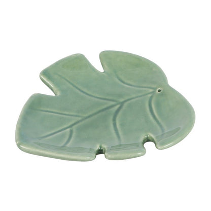 Green ceramic cute leaf-shaped incense stick holder. Can be used as a trinket dish or candle holder as well.