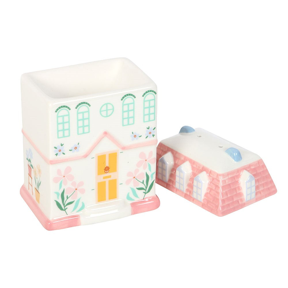 Pastel cute house oil burner with lid. Pink pastel house design with print of windows, door, flowers.