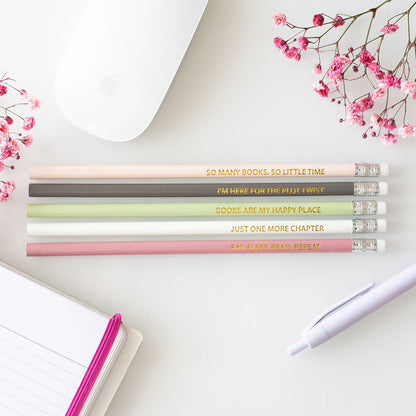 Set of pastel pencils with motivational quotes for readers.