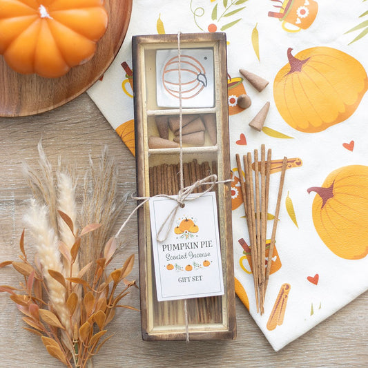 Pumpkin pie scented incense bundle set with decorative packaging on a wooden surface.