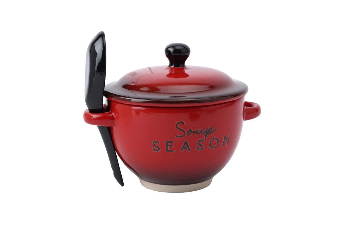 Red ceramic soup bowl with a lid and spoon on a white background
