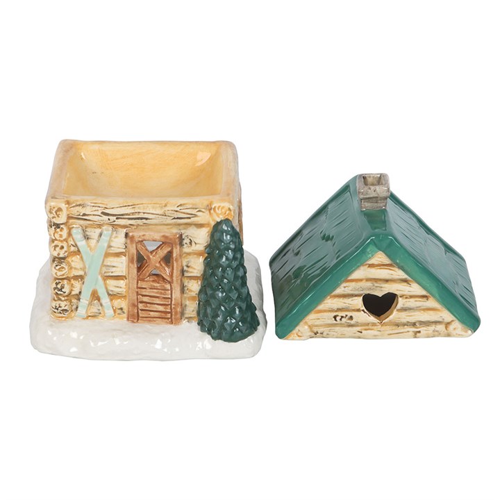 Two small decorative houses with a tree on a white background