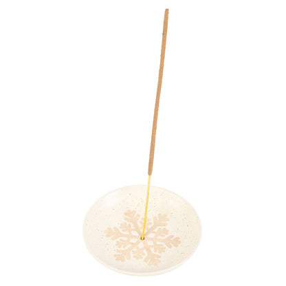 Incense stick on a decorative holder with a white background