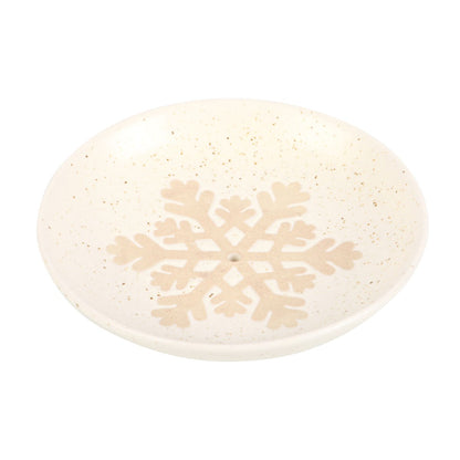 Decorative plate with a snowflake design on a white background