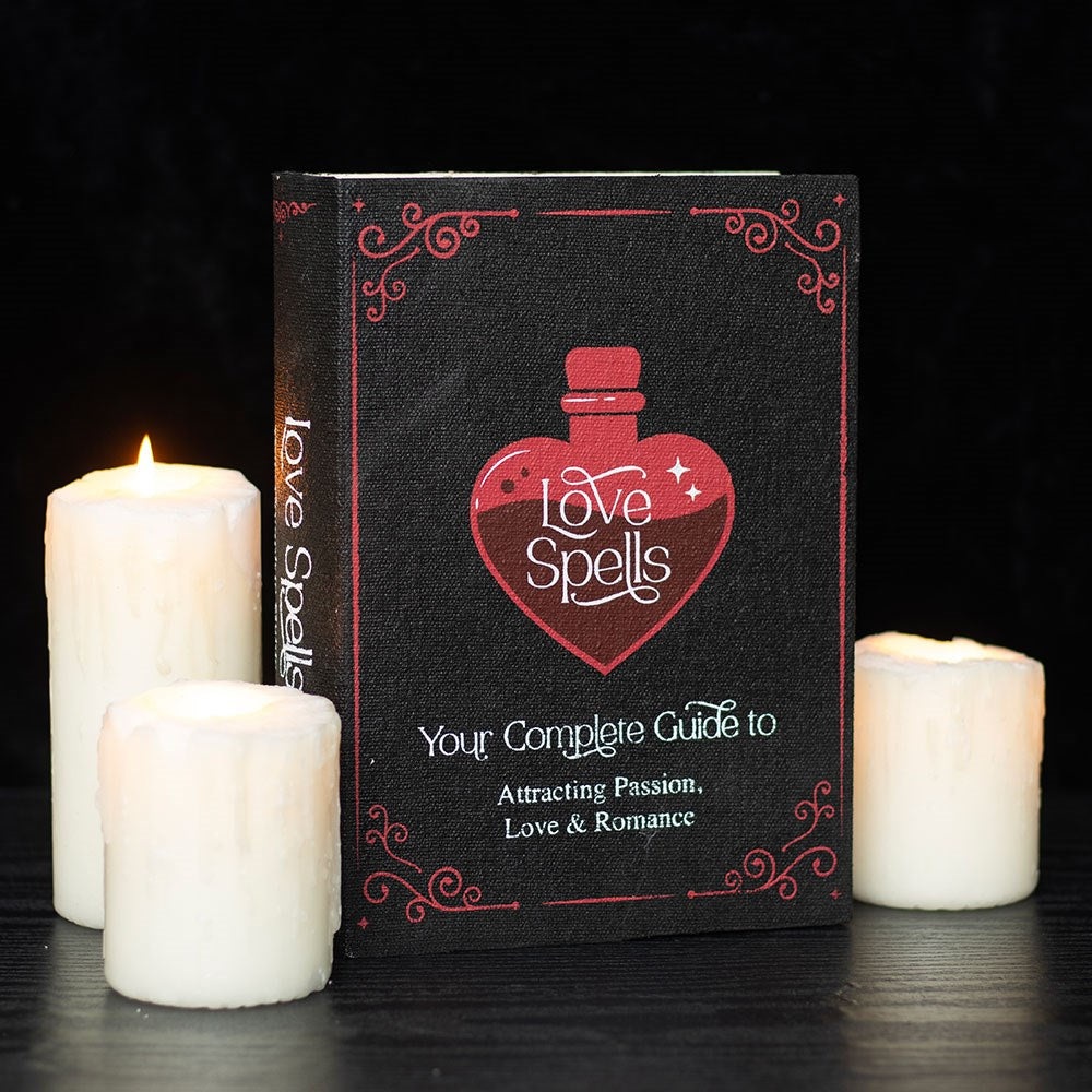 Storage box shaped as a book that is titled 'Love Spells' and has a heart-potion glass design.