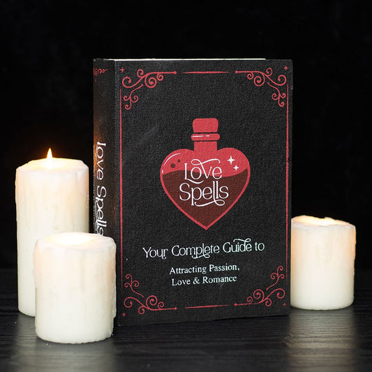 Storage box shaped as a book that is titled 'Love Spells' and has a heart-potion glass design.