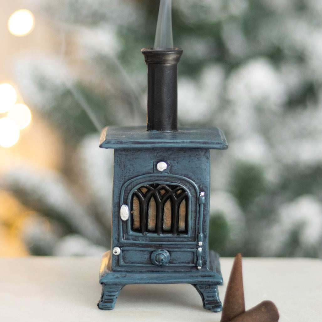 Decorative miniature stove with a blurred natural background