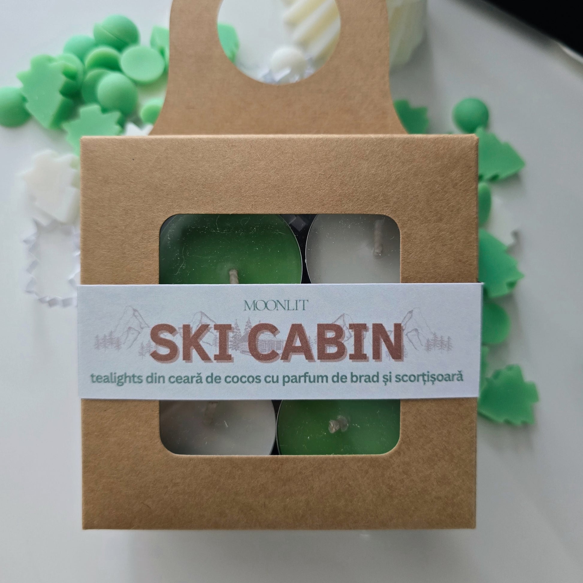 Packaged tealights with 'Ski Cabin' label on a white background