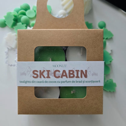 Packaged tealights with 'Ski Cabin' label on a white background