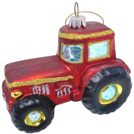 Red tractor ornament with gold accents.