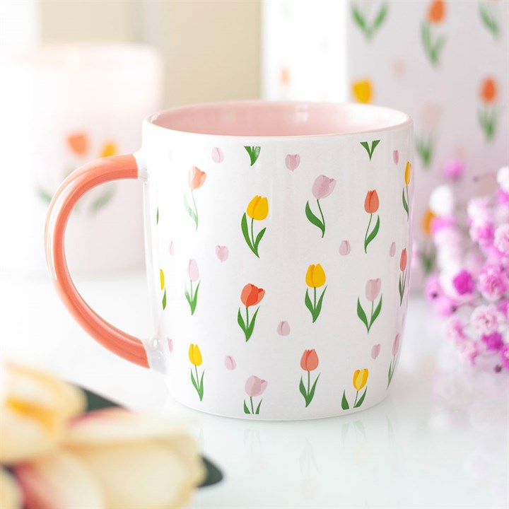 Coffee cup or tea mug with floral tulips pattern inspired by spring.