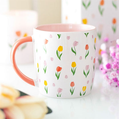 Coffee cup or tea mug with floral tulips pattern inspired by spring.