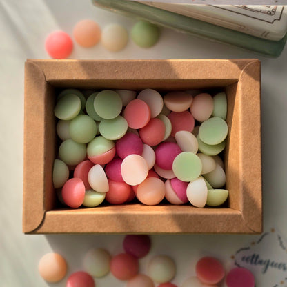 Colorful round cottagecore aesthetic wax melts in a cardboard box, smell of lilies and cotton