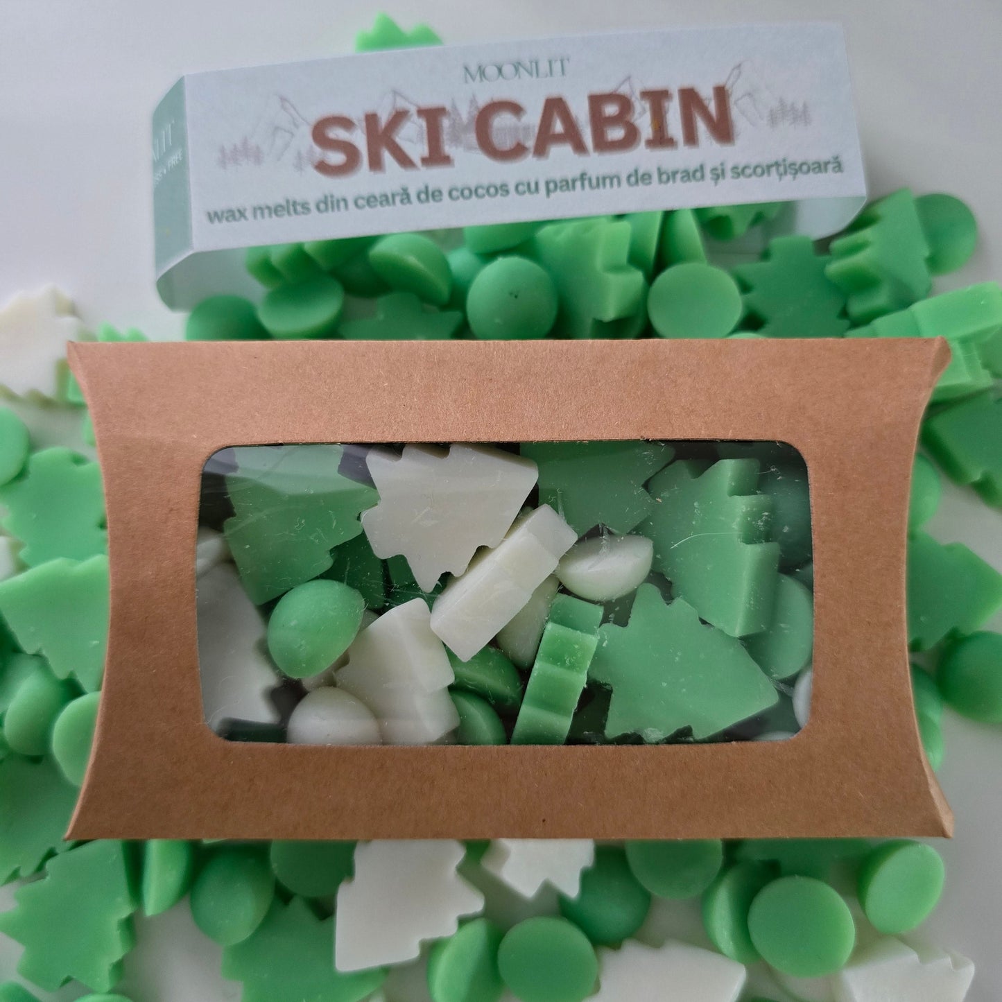 Green and white wax melts in a brown box with 'Ski Cabin' packaging.