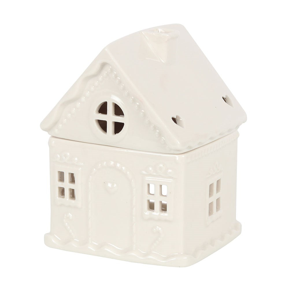 White ceramic house-shaped oil burner on a white background