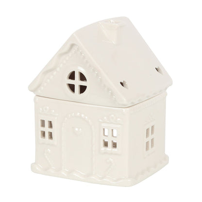 White ceramic house-shaped oil burner on a white background
